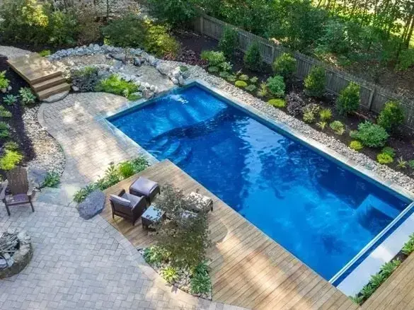 in-ground pool contractor working near Mahogany Lake with safety barriers in place